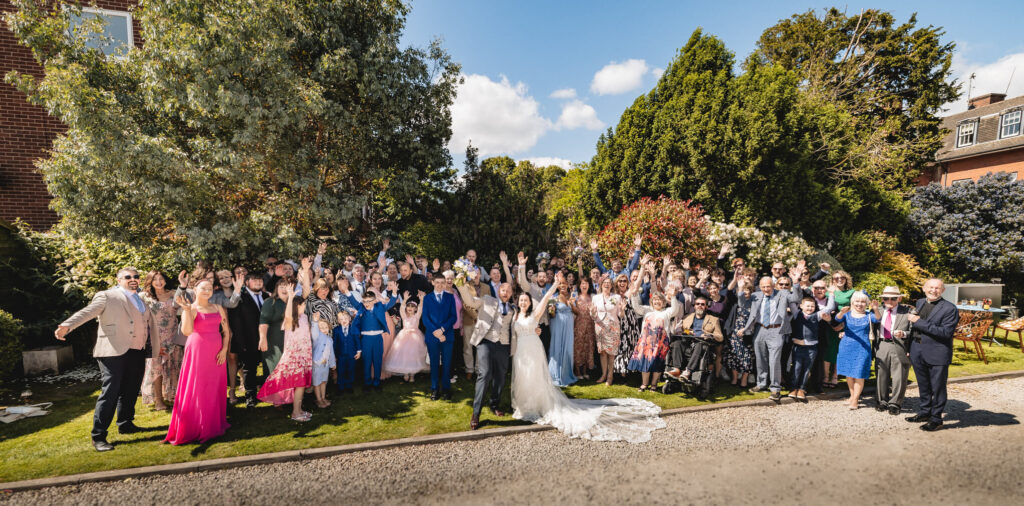 Entire wedding photo in the garden of St Johns House in Lichfield