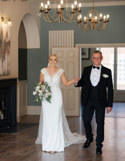 Bride and father walking through St Johns House in Lichfield