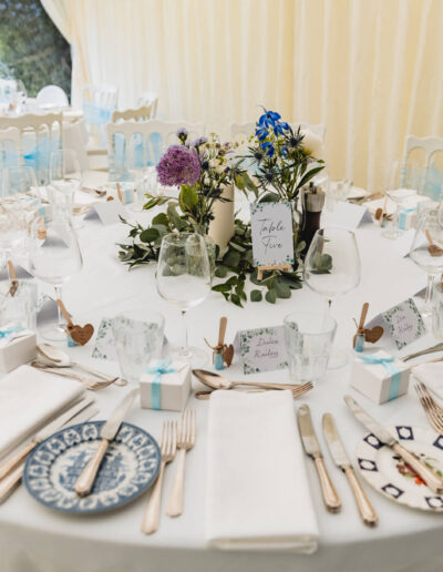 Wedding tables decorated with flowers, name labels and flowers at St Johns House in Lichfield
